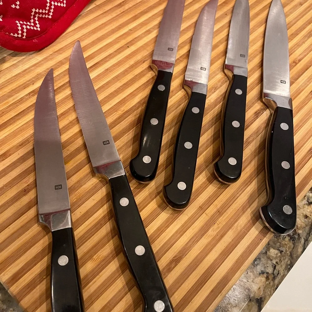 Set of Six Black Handle Wolfgang Puck Steak Knives